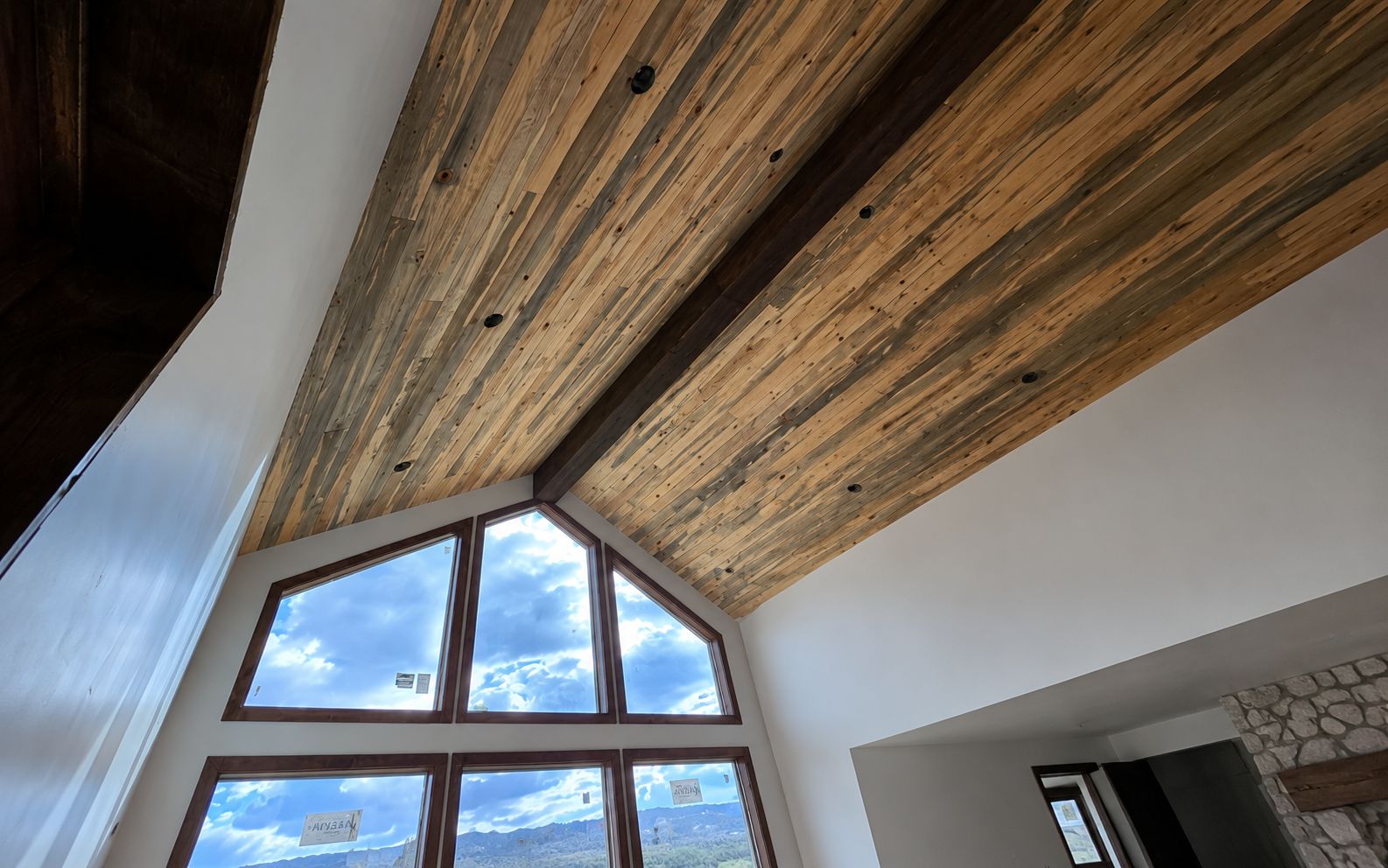 Blue pine ceiling with faux beam, alder jamb and cased windows